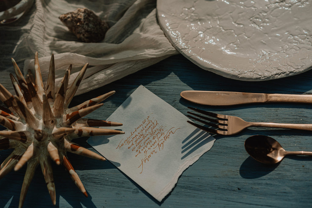 Table details of an elopement in Italy including a hand written love note