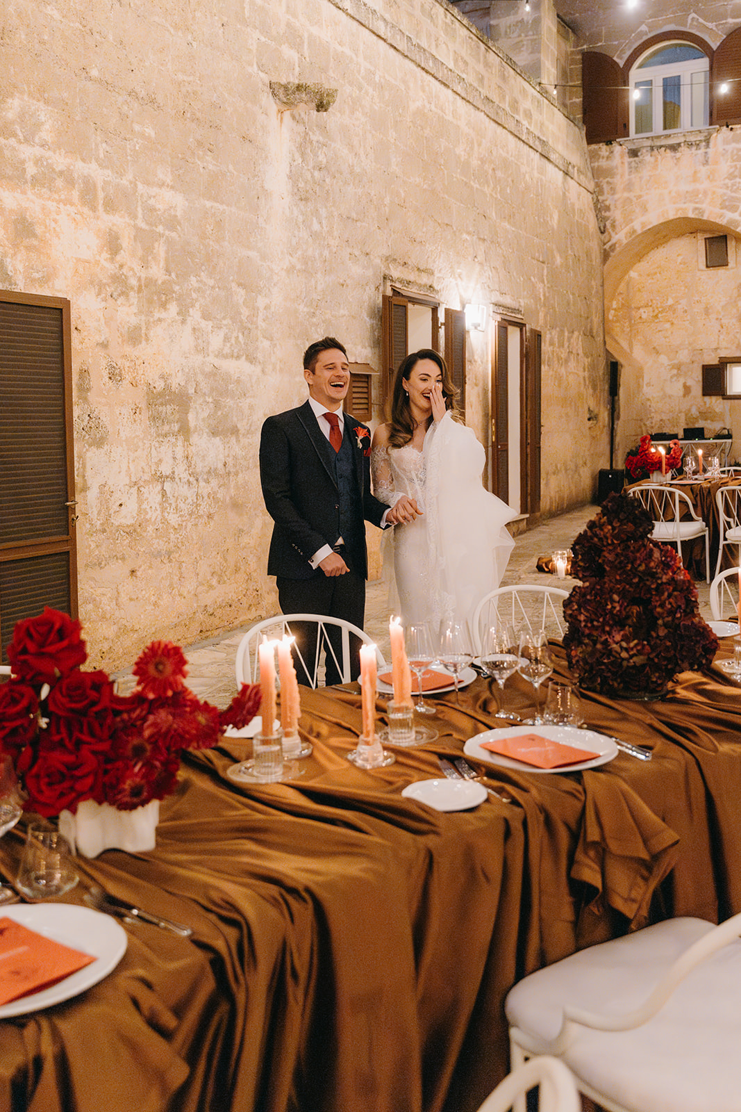 Destination Wedding Planning Guide. Couple admiring their wedding reception in Italy.
