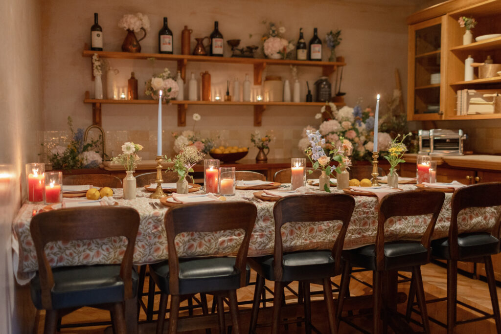 An intimate dinner table with foam free flowers repurposed from the wedding ceremony.